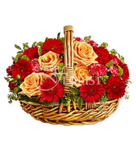 roses gerberas and carnations in a basket